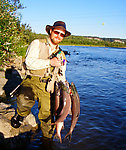 A professional photographer (whose name I forgot to get) just happened to be nearby as I finished up my sockeye fishing with this hefty limit of fresh, tasty salmon.  He took several pictures with his good camera, which hopefully he'll be sending me soon, and he snapped this one with my point+shoot camera. From the Gulkana River in Alaska.